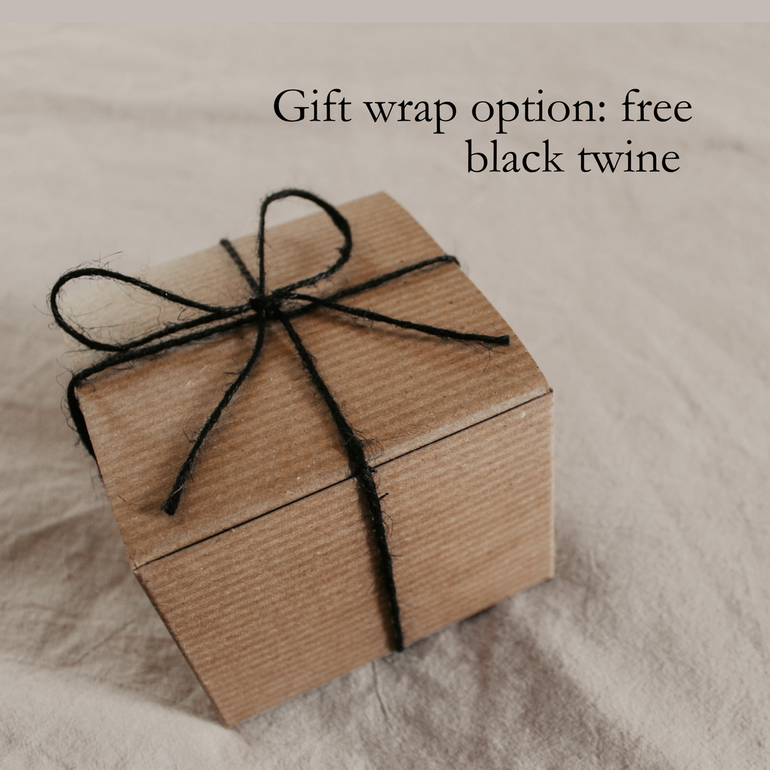 a kraft gift box wrapped in black twine