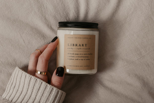 Perfect for book lovers, our literary Grace + Bloom candles are hand-crafted in our sunny shop from natural soy wax with cotton wicks for a clean burn experience, while their modern and minimalist design adds a special touch to any home. With warm, book-inspired scents and a cozy glow, you can create the perfect ambiance for unwinding and curling up with a good book! They also make a thoughtful and sophisticated gift idea for your favorite bookworm.