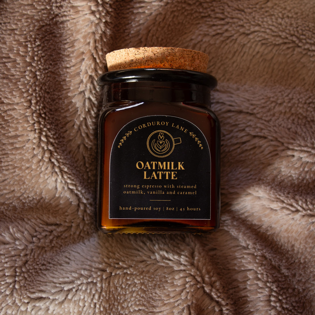 Jar of 'Oatmilk Latte' on a textured brown surface