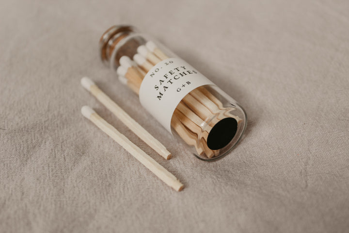 A decorative bottle of matches can be such a cute addition to your decor while keeping them handy for lighting your candles. Corduroy Lane white-tipped safety matches are in a cork-topped apothecary vial with a striker pad on the bottom of the bottle.
