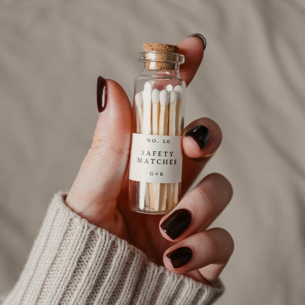 A decorative bottle of matches can be such a cute addition to your decor while keeping them handy for lighting your candles. Grace + Bloom Candle Co white-tipped safety matches are in a cork-topped apothecary vial with a striker pad on the bottom of the bottle.