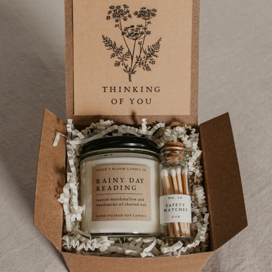 A cozy gift box from Corduroy Lane is perfect for bookish friends, has a candle in your choice of literary scents, a glass bottle of matches, and has a removable kraft-colored card with a floral design and your choice of messages on it. 