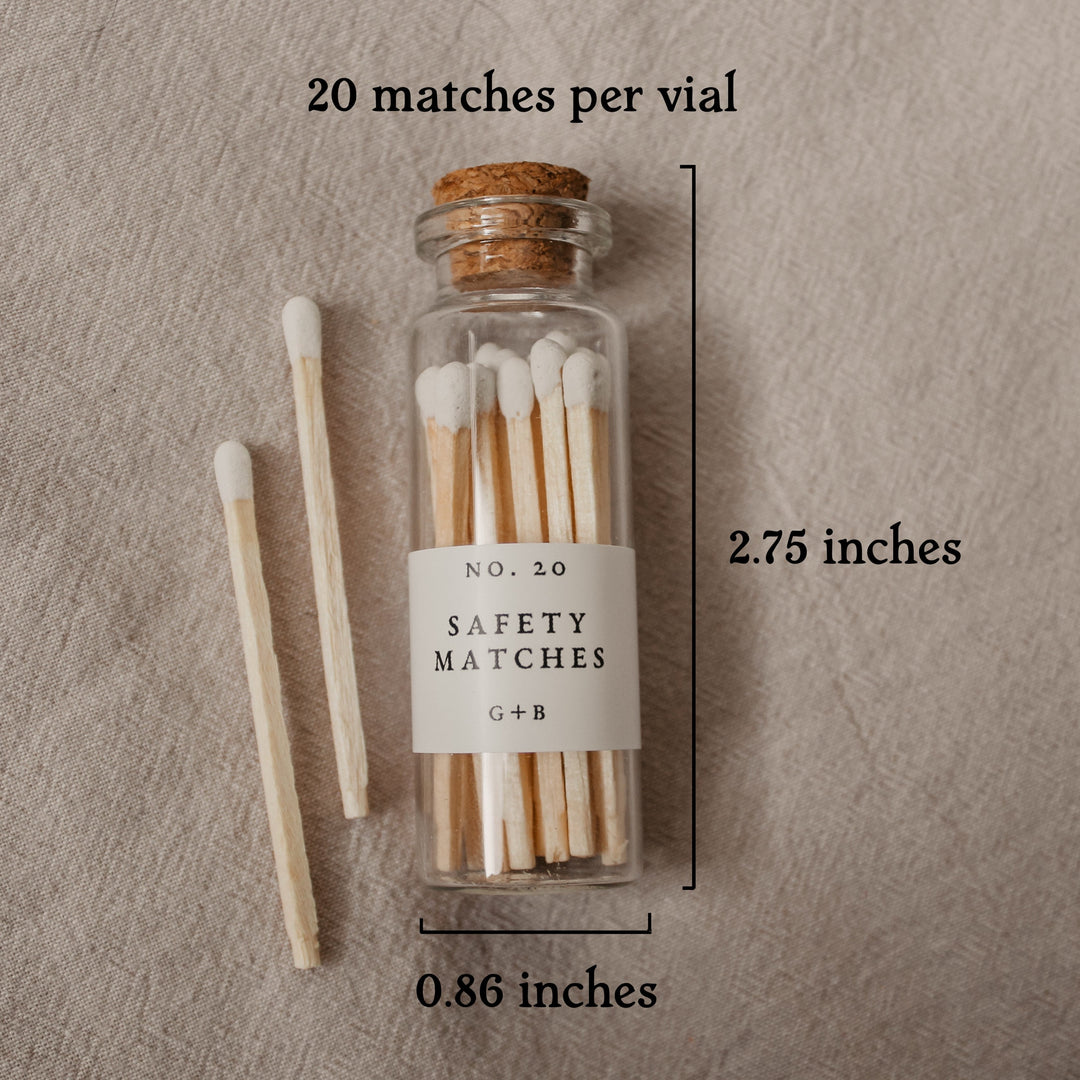 Our pretty glass bottles with cork lids come in the dark academia gift box with 20 safety matches. This picture shows their measurement of 2.75" x .86"
