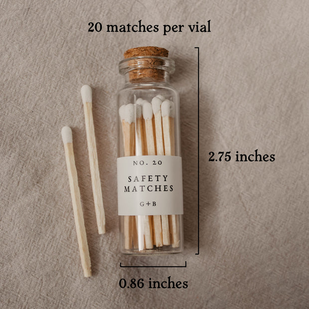 Our pretty glass bottles with cork lids come in the dark academia gift box with 20 safety matches. This picture shows their measurement of 2.75" x .86".